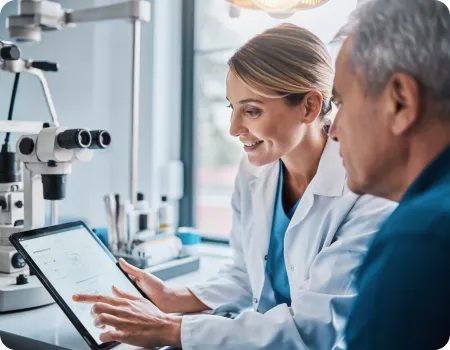 A calm ophthalmology consultation: a surgeon gently explaining a cataract procedure to a patient